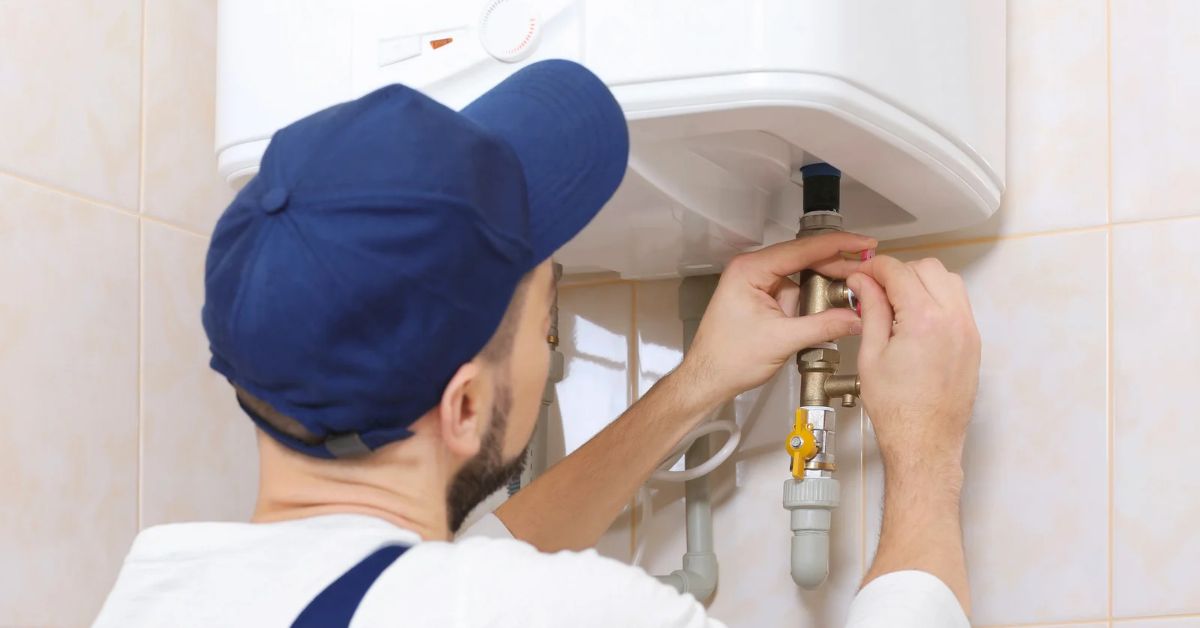Plumber doing a gas geyser installation