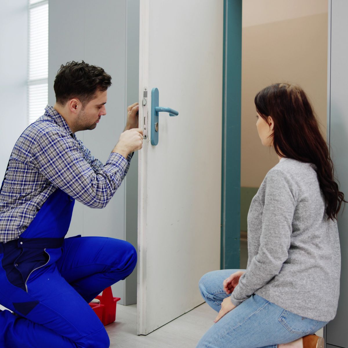 Locksmith working on a door lock